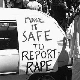 "Make it safe to report rape" banner at the Prostitutes' Collective demonstration, January 1992.