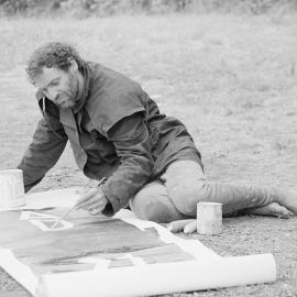 Benny Zable creating another banner at the Australian International Defence and Equipment Exhibition (AIDEX) protest, Canberra, 26 November 1991.