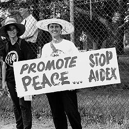 "Promote peace, stop AIDEX" banner at the Australian International Defence and Equipment Exhibition (AIDEX) protest, Canberra, 26 November 1991.