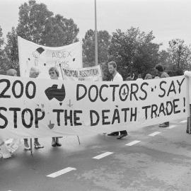 "1200 doctors say stop the death trade" banner at the Australian International Defence and Equipment Exhibition (AIDEX) protest, Canberra, 26 November 1991.