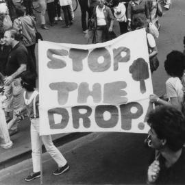 "Stop the drop" banner at Palm Sunday rally, April 1984..