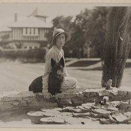 [Mab and Scottish Terrier at lilypond] Westerfield