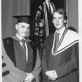 Dr. Robin Sharwood, (left), Faculty of Law, with his godson, John Daley.