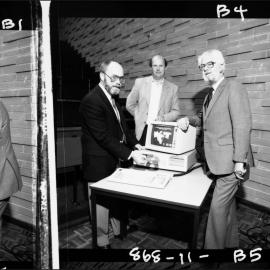 Massey, Dr Jack (left) of Geography, Jeff Leeuwenburg, Baillieu Library and Dennis Richarson, University Librarian, at a demonstration of Supermap 1, a CD-ROM system for census analysis and mapping