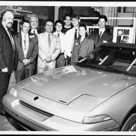 Watson, Dr Harry (left) with others and Nissan Hydrolic car
