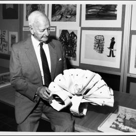 Dax, Dr Eric Cunningham, with one of the works from the Psychiatric Art Collection, Horsham Regional Art Gallery.