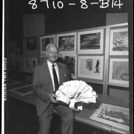 Dax, Dr Eric Cunningham, with one of the works from the Psychiatric Art Collection, Horsham Regional Art Gallery.