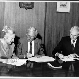 Amalgamations. At the signing of the Hawthorn Institute of Education agreement are, from left, Dr June Hearn, Director of the Institute, the Vice-Chancellor, Professor David Penington, and the University’s Registrar, Jim Potter