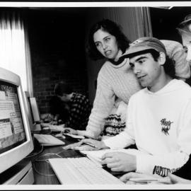 Biology. Roslyn Gleadow works with two students on one of the programs