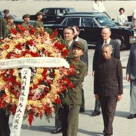 Malcolm Fraser and others follow Chinese soldiers carrying an Australian wreath to the Monument to the People's Heroes in Beijing, China.
