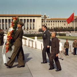 Malcolm Fraser and Han Xu, Vice Foreign Minister of China, follow soldiers carrying an Australian wreath at the Monument to the People's Heroes in Beijing, China.