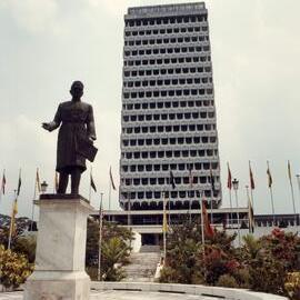 The Malaysian Parliament House and Tunku Abdul Rahman's statue in central Kuala Lumpur, Malaysia, 1982.