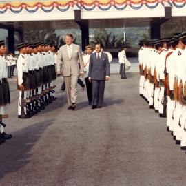 Malcolm Fraser and the Malaysian Prime Minister Mahathir Mohamad walking together in Kuala Lumpur.