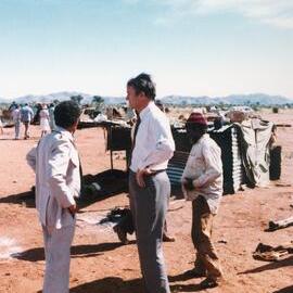Malcolm Fraser and Charles Perkins visiting an Aboriginal Australian settlement in the Northern Territory.