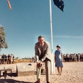 Malcolm Fraser turning the first sod at the start of the Yulara Tourist Resort project.