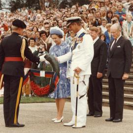 Queen Elizabeth II and the Duke of Edinburgh at a dedication of a memorial for the Royal Regiment of Australian Artillery Canberra, during their 1977 official visit to Australia.