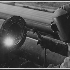 Photographs of workers at their jobs, special events, and training courses [9 of many]