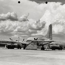 A Douglas DC-4 Skymaster aircraft, undergoing refuelling at Parafield Airport, Adelaide, South Australia.