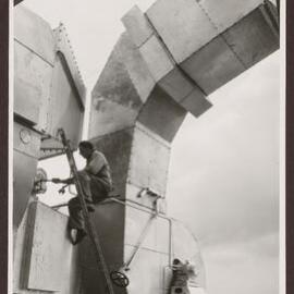 Men working on outdoor machinery