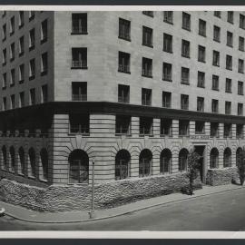 Shell House, Sydney with sandbags stacked around base