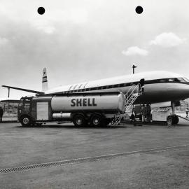 A Shell Aviation Service pump tanker being used to refuel a British Overseas Airways Corporation de Havilland DH-106G Comet 111, with British registration G-ANLO, on the tarmac at Mascot Airport, Sydney