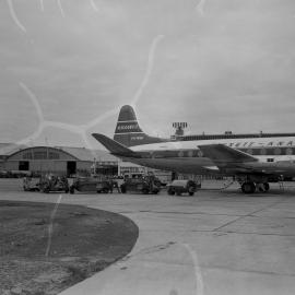 An Ansett-ANA British built Vickers Viscount 11 carrying Australian registration VH-RMI, being refuelled by Shell Australia workers, in front of terminal buildings at an unidentified Australian airport