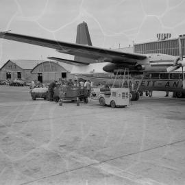 An Ansett-ANA Fokker F27 Friendship being refuelled by Shell Australia workers in front of terminal buildings at an unidentified Australian airport