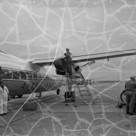 An Ansett-ANA Fokker F27 Friendship being refuelled by Shell Australia workers on the apron of an unidentified Australian airport