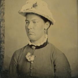 Portrait of an unidentified woman wearing a hat.