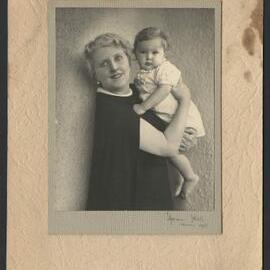 Portrait of Louise Dyer holding a baby