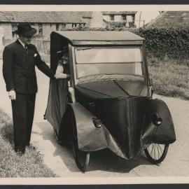 Jeff Hanson and Louise Hanson-Dyer with the bicycle car at Pin Farm Cottage