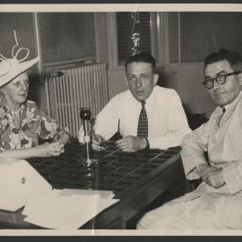 Louise Hanson-Dyer, Francis Poulenc and Jeff Hanson seated around an interview microphone in Strasbourg
