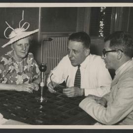 Louise Hanson-Dyer, Francis Poulenc and Jeff Hanson seated around an interview microphone in Strasbourg