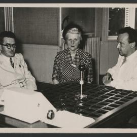 Jeff Hanson, Louise Hanson-Dyer and Arthur Honegger seated at an interview table in Strasbourg