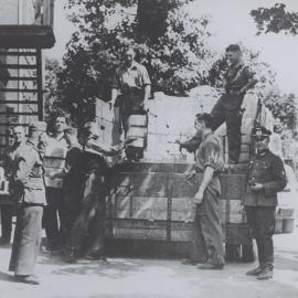 Prisoners of war camp: Stalag XX A. English Red Cross parcels being received and unloaded.Thorn, Germany