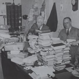 Packing books for POWs St. John and Red Cross labels