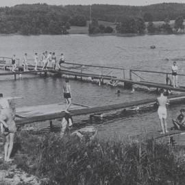 Unidentified prisoners of war camp: Group of men swimming & diving