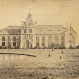 Eastern side of National Museum with lawn and lake in foreground, University of Melbourne, 1862-1899.