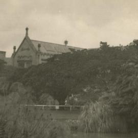 North-eastern corner of Main building with lake in foreground, University of Melbourne, circa 1936.