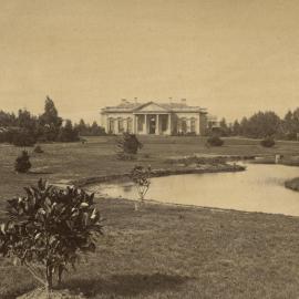 Old Medical building with lake and lawns in foreground, University of Melbourne.