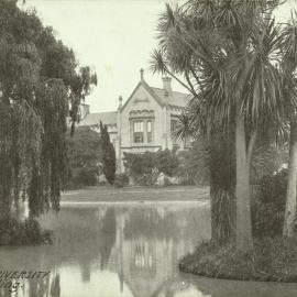 View across lake to main building, University of Melbourne, circa 1910.