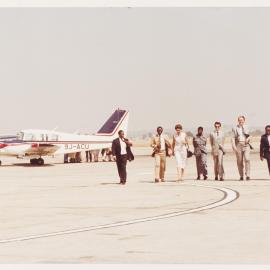 [Tamie and Malcolm Fraser and others at an airport in Lagos, Nigeria]