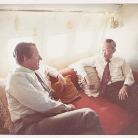 [Malcolm Fraser and unknown man on an aeroplane]