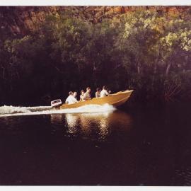 [Malcolm and Tamie Fraser and others in a tinnie during a visit to the Northern Territory]