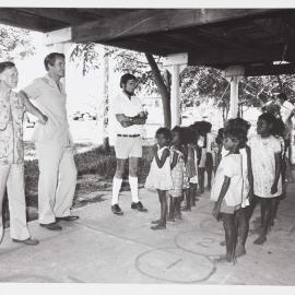 [Malcolm Fraser and other men with Aboriginal Australian children during a visit to the Northern Territory]