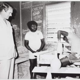 [Malcolm Fraser and two unidentified Aboriginal men engaged in pottery during a visit to the Northern Territory]