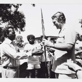 [Malcolm Fraser being presented with gifts by unidentified Aboriginal Australian men during a visit to the Northern Territory]