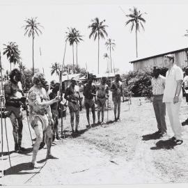 [Malcolm Fraser and a group of Aboriginal Australian men in traditional painting during a visit to the Northern Territory]