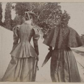 [Two women photographed from behind]