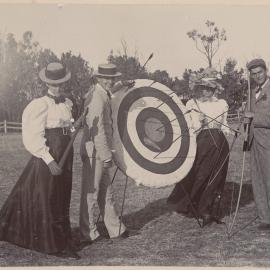[Two men and two women with archery target] 